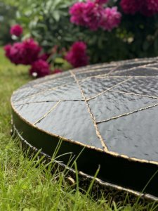 Dekoruotas šulinio dangtis