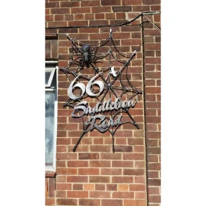 Spider web with house number and street name